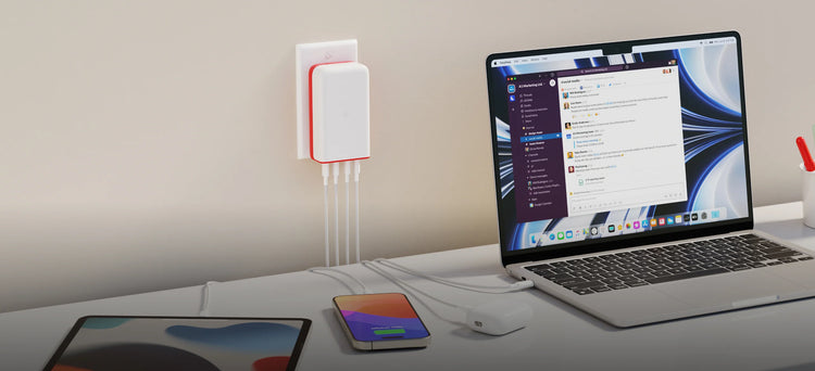 white and red plugbug on table with macbook, iphone, airpods, ipad